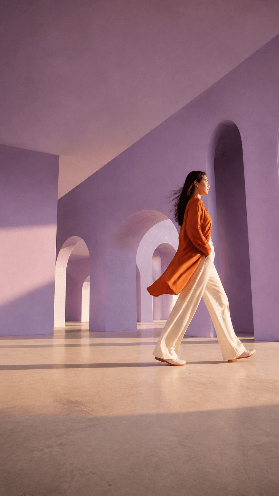 Original fashion campaign still in a lilac architectural scene