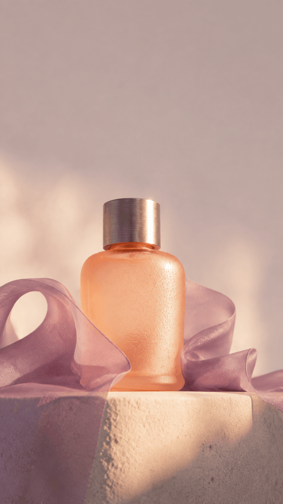 Original perfume campaign still in peach and lilac light